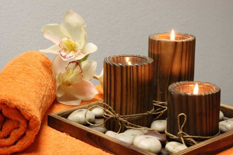 Photo of candles in a spa setting.