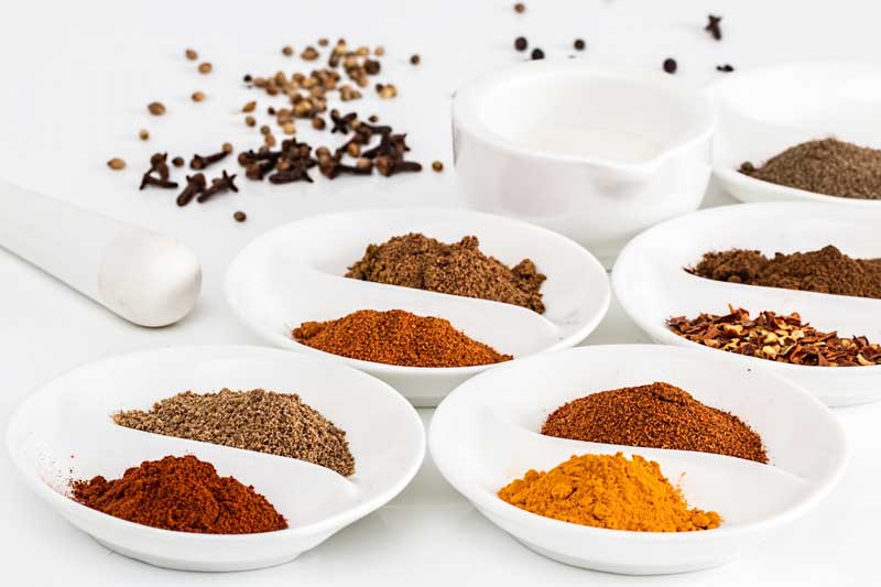 Photo of bowls of cooking spices.