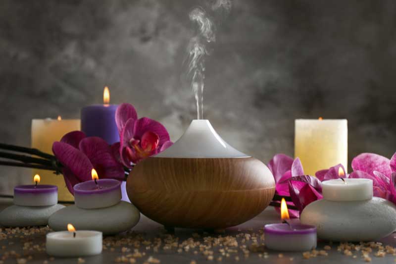 Photo of candles lit in a spa.