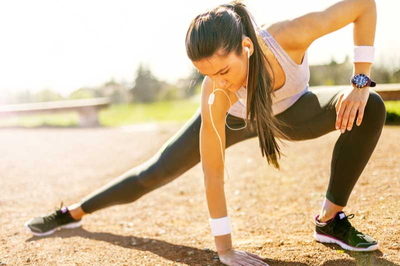 Photo of woman stretching before exercise.